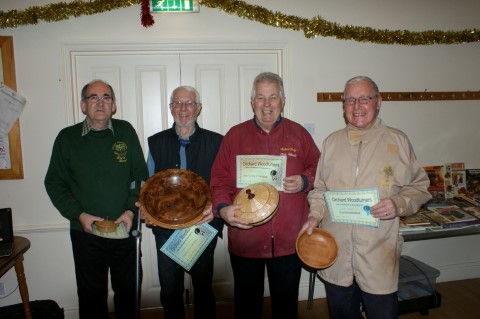 The December winners. Don't they look pleased